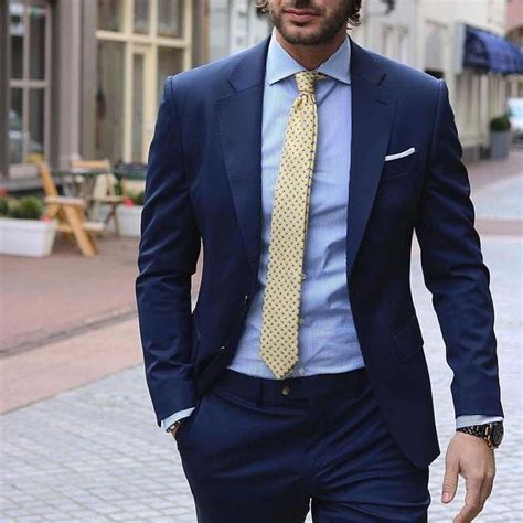 navy blue suit yellow tie.